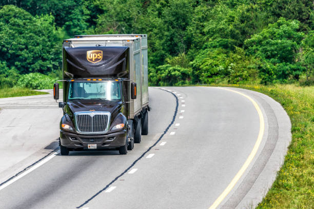 UPS Dual Trailer Rig Travels Interstate with Copy Space"n stock photo