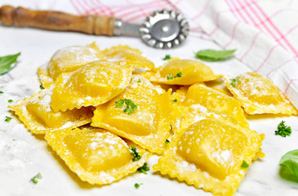 istock Ravioli pasta, homemade pasta and pasta roller 999335254