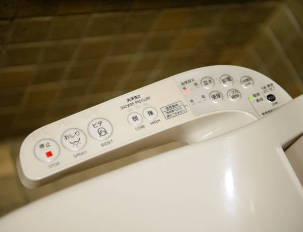Modern high tech toilet with electronic bidet in Japan Modern high tech toilet with electronic bidet in Japan. japanese toilet stock pictures, royalty-free photos & images