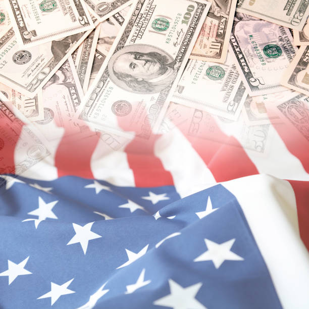 istock USA flag and cash 999354584