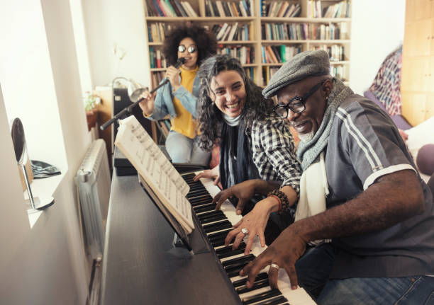 istock Music Teacher Having Lesson At Piano 999362240