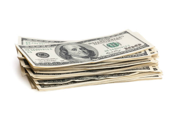 istock A stack of one hundred dollar bills on a white background. Isolated. 999380284