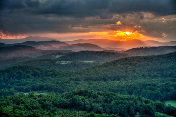 summer sun setting on the blue ridge mountains in north carolina - storm summer forest cloudscape imagens e fotografias de stock