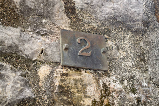 istock House number two on an ancient stone wall 999410668