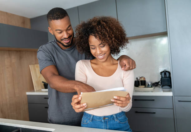 istock Black couple at home checking their mail 999411348