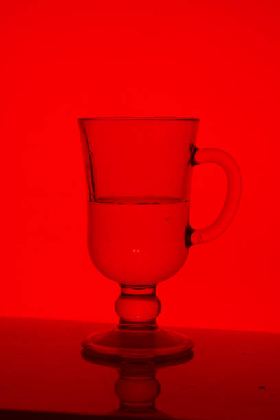 A glass beverage glass. In backlight.