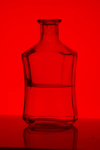 istock Alcoholic beverage in a glass bottle. 999412684