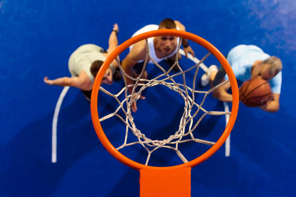 istock Friends playing street basketball 999440986