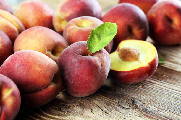 istock A group of ripe peaches on table 999453462