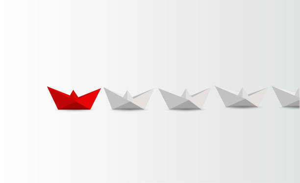 istock Leadership concept. Red and white paper boats. business concept. 999453926