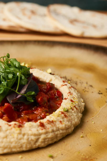 istock Delicious Hummus with harissa sauce and pistachios 999464122