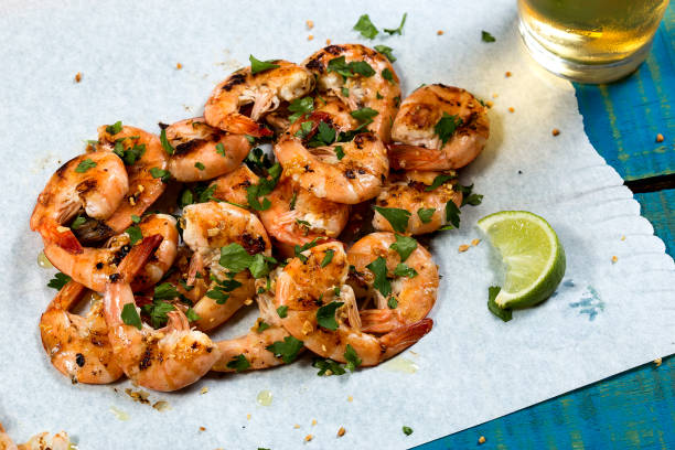 istock Fried shrimp with garlic and parsley in olive oil 999481992