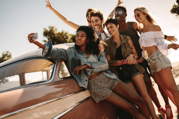 istock Friends on road trip posing for a selfie 999484962