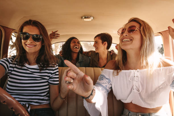 istock Women enjoying themselves on a road trip 999486346