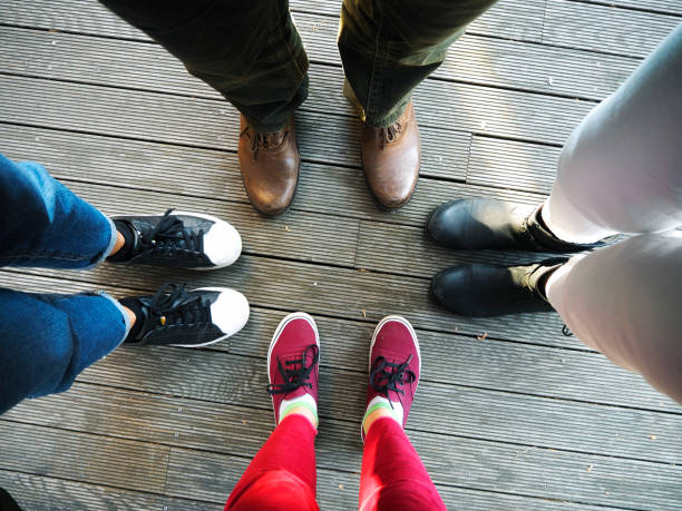 4 of a kind Family feet running shoes on floor stock pictures, royalty-free photos & images