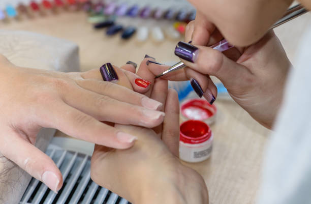 istock painting nails in nail salon, manicure 999524996