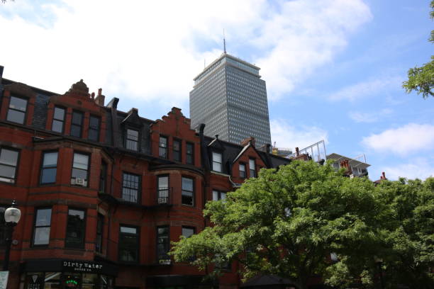 Victorian Buildings with the Prudential Center Boston, USA- June, 2018:Newbury Street buildings with the prudential center behind them boston prudential building stock pictures, royalty-free photos & images