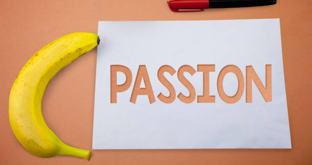 istock Text sign showing Passion. Conceptual photo Strong and uncontrollable emotion Powerful feeling Sexual attraction Small paper drawing lines office work refreshment banana plane background. 999640598