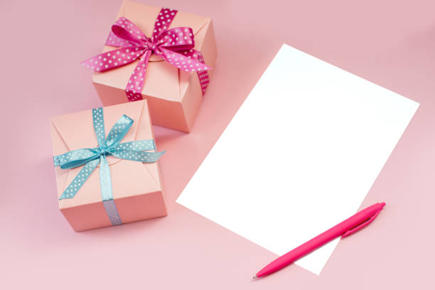 istock Decorated boxes and blank white sheet of paper 999643274