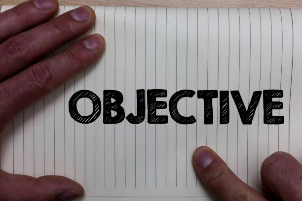 istock Writing note showing Objective. Business photo showcasing Goal planned to be achieved Desired target Company mission Notebook register line drawing office routine hand fingers busy work. 999653578