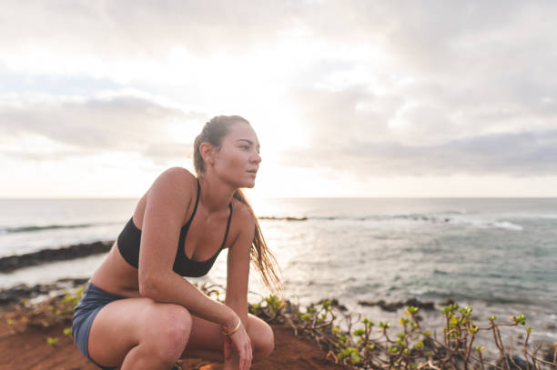 istock Eurasian Woman Running Along Ocean 999669928