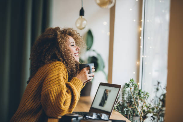 Enjoying of work and coffee Young woman Enjoying of work and coffee sweater stock pictures, royalty-free photos & images