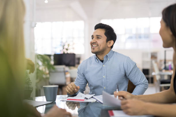 istock Hispanic male leads a business strategy meeting 999675972