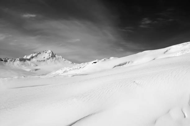 istock Black and white snowy mountains at winter 999678834