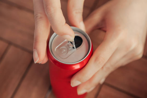 Soda can thrown away in grass. Garbage in nature, reusable products. Rubbish thrown in forest. Beer can thrown out in park. Waste in nature. Abandoned beer can garbage waste. Thrown out Crushed juce.