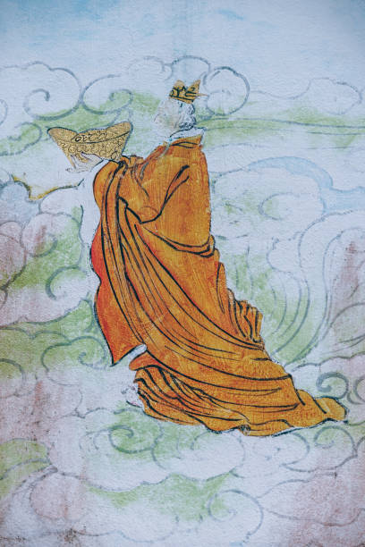 Buddhist monk painting hanging on the wall. Monk with the yellow robe is holding a yellow bowl.