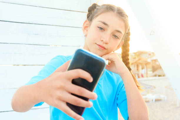 istock Beautiful girl making selfies 999752880