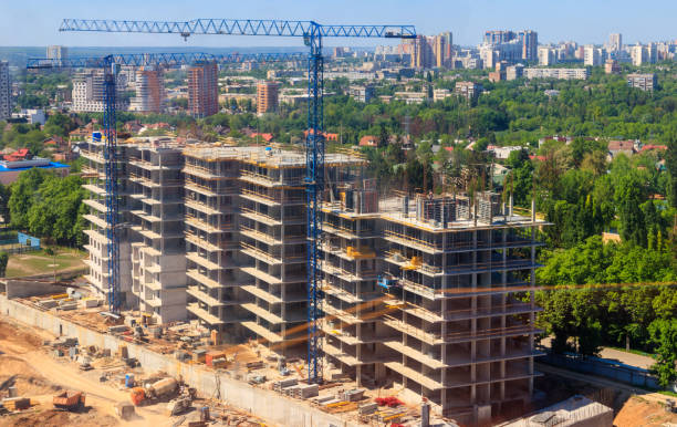 istock Building crane and house under construction 999753174