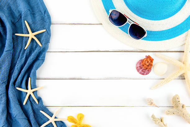 istock Summer holiday beach background with accessories and shells on white wood panel 999755616