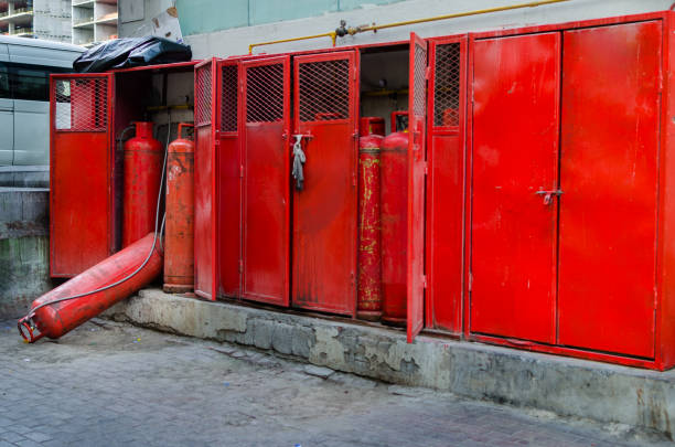 Unsafe LPG tank storage LPG Tank fell down or intentionally placed down unsafely to use most of the gas flammable cabinet stock pictures, royalty-free photos & images