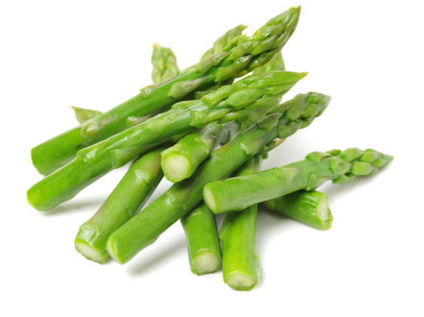 istock Fresh ripe asparagus on a white background 999757908