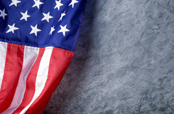 istock American flag on cement background with copy space 999763814
