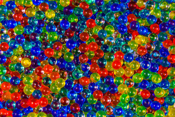 istock Texture of multicolored hydrogel balls for the background 999767156