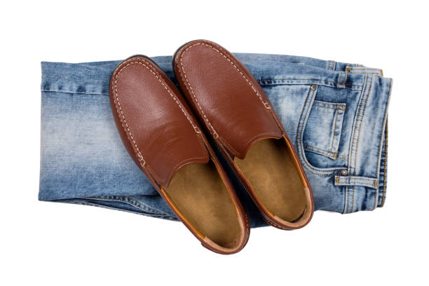 Pair Of Leather Shoe On Blue Denim Isolated On White Background