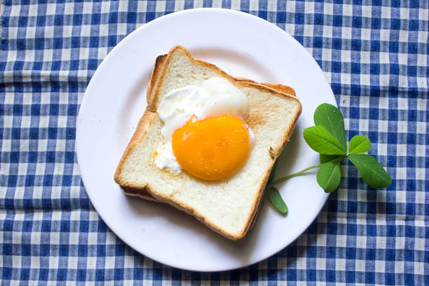 istock The eggs on the bread are in a white plate. 999781474