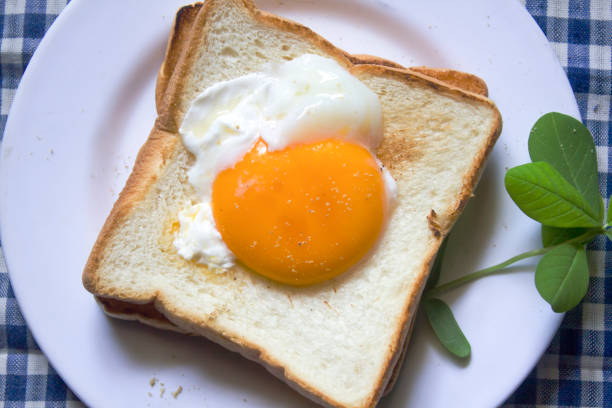 istock The eggs on the bread are in a white plate. 999781514