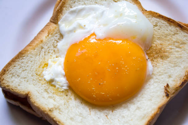 istock The eggs on the bread are in a white plate. 999781722