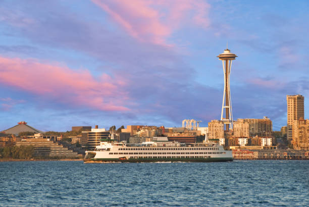 Puget Sound is a special body of water that belongs exclusively to Washington State. From the saltwater marshland of Olympia and Nisqually to the windy Strait of Juan de Fuca and the San Juan Islands, Puget Sound exhibits a quiet beauty that is quintessentially Washington. Puget Sound and its adjacent waters form a vast inland extension to the Pacific Ocean. Its complex network of straits, bays, canals and inlets give Western Washington a distinctive personality. Puget Sound along with its surrounding mountains has a major effect on the region's temperate climate. The area was first visited by Europeans in 1792 with British explorer George Vancouver's expedition. Captain Vancouver gave the region many of the place names which are still in use today. Not only does Puget Sound have a rich history, it also has some of the greatest scenery in the country. Sunsets over Puget Sound can be especially beautiful and an inspiration to photographers. This skyline sunset was photographed from Duwamish Head in Seattle, Washington State, USA.