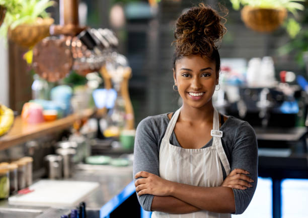 istock Beautiful waitress working at a cafe 999791054