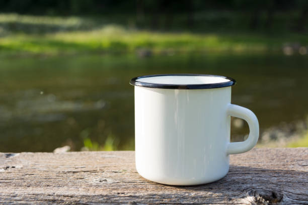 istock White campfire enamel mug mockup with sun beams 999791758