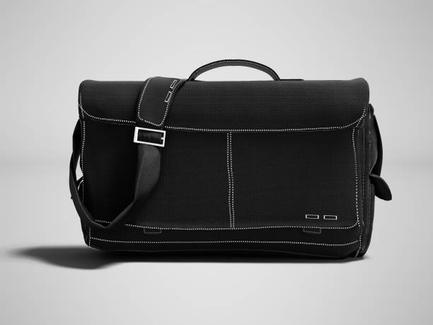istock Modern black laptop bag over the shoulder 3D render on gray background with shadow 999794490