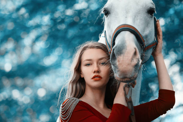 istock fashion model with her horse 999800120