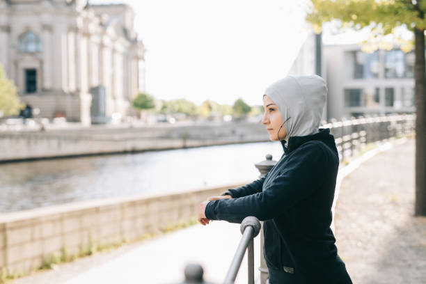 istock Woman taking a break from running. 999805730