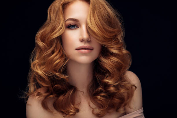 red haired woman - beautiful red hair curly hair human hair imagens e fotografias de stock