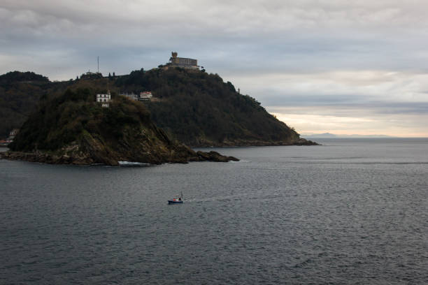 istock Small fishing boat entering La Concha Bay 999811450