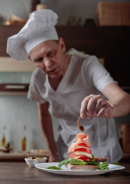 istock Chef prepares a snack with mozzarella and smoked meat . 999815194